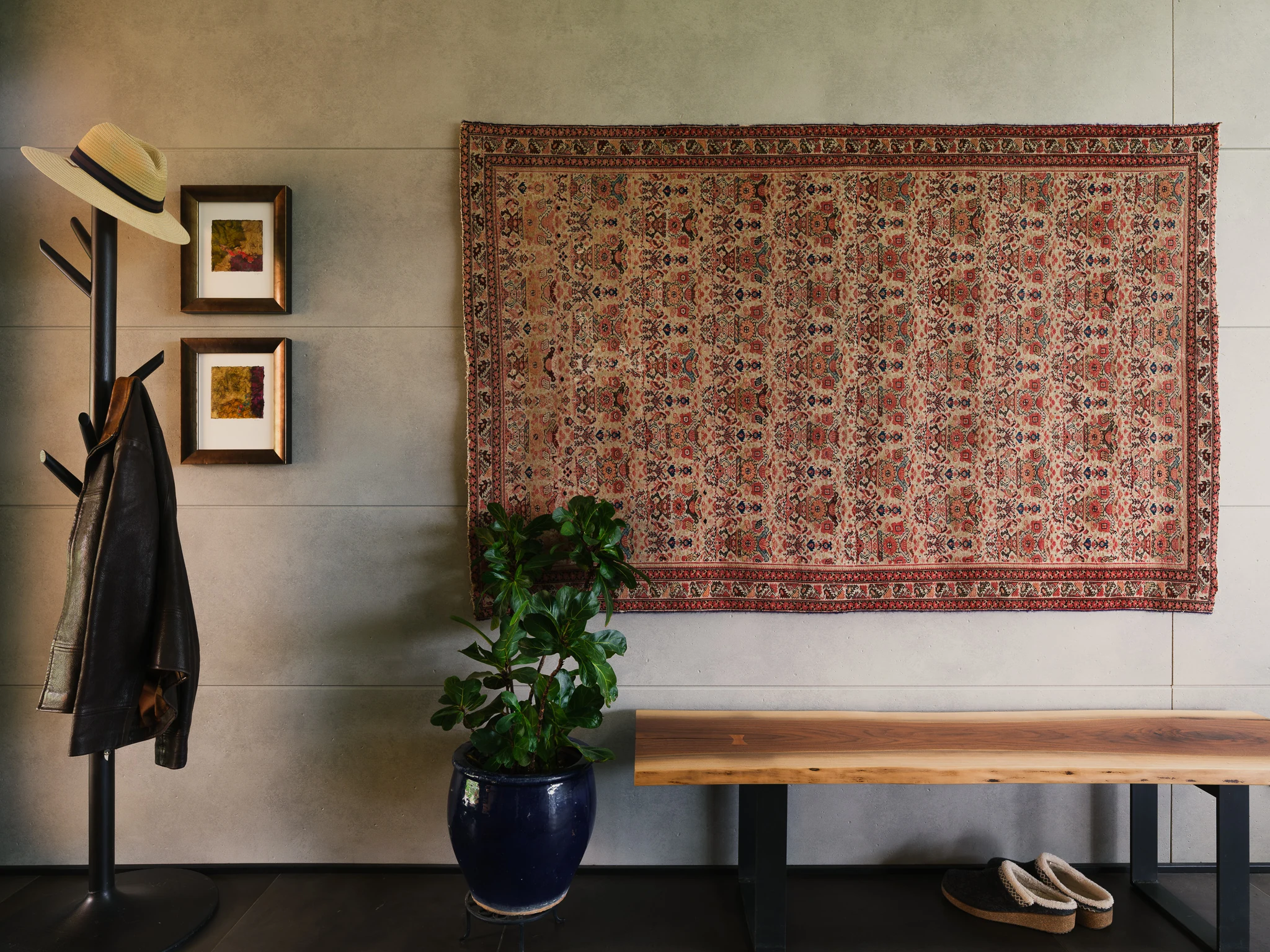 Entry styled with a vintage rug, coat rack, and live-edge bench — interior design photography Bozeman Montana, Living Places Design Studio
